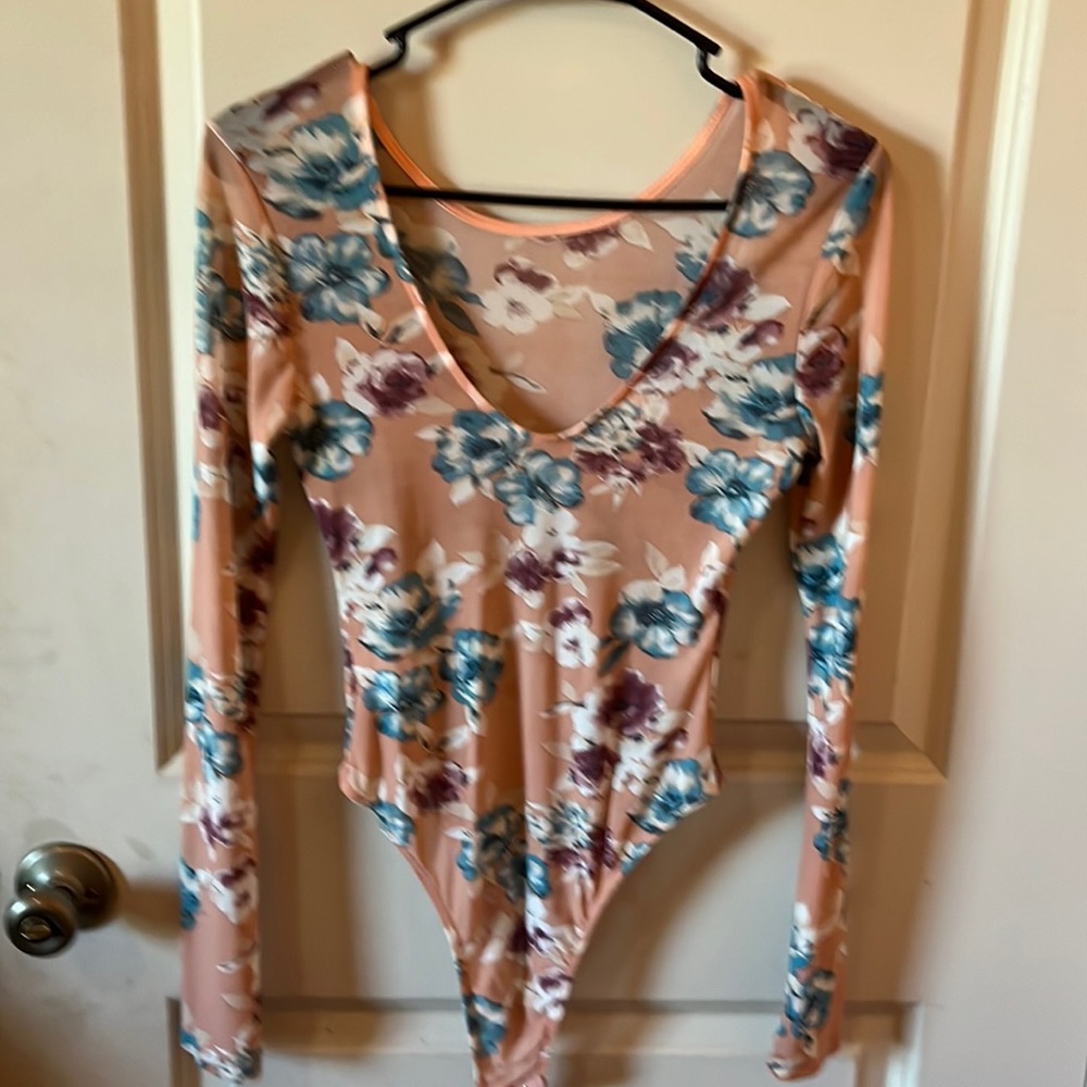 Sheer body suit not sure what size but I think it’s medium..